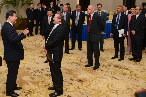 President Xi Jinping shares a light moment during his meeting with business leaders attending the Boao Forum for Asia Annual Conference 2013 in Boao, Hainan province, on Monday. Liao Pan / China News Service Fast growth to continue, Xi says