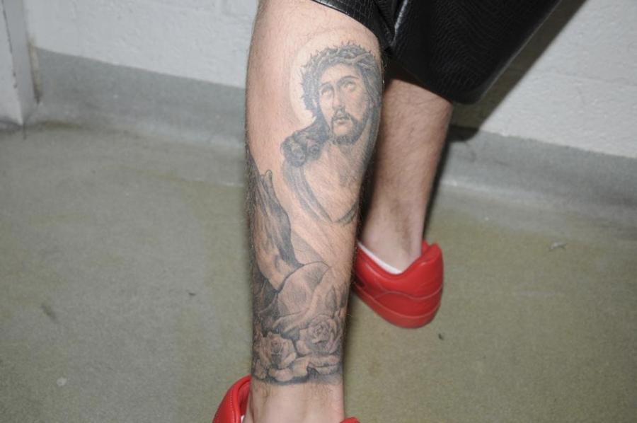 Handout shows Justin Bieber in police custody