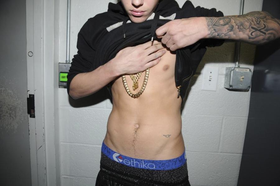 Handout shows Justin Bieber in police custody