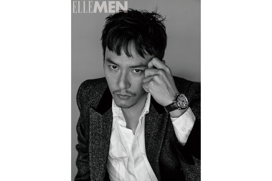Actor Zhang Zhen poses for the fashion magazine