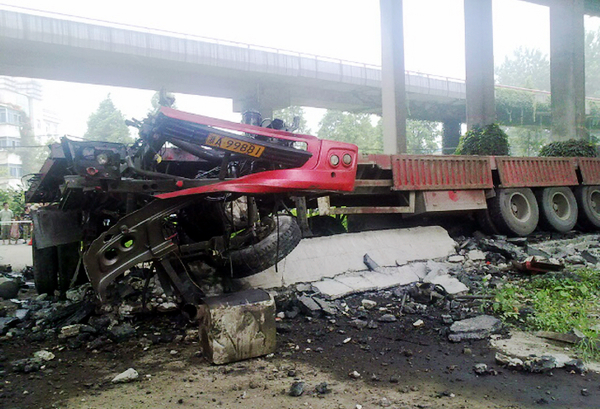 Truck driver injured in bridge cave-in Truck driver injured in bridge cave-in