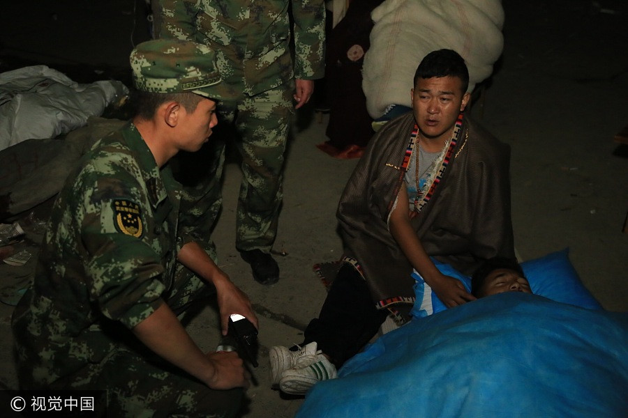 Rescuers work overnight to save quake victims