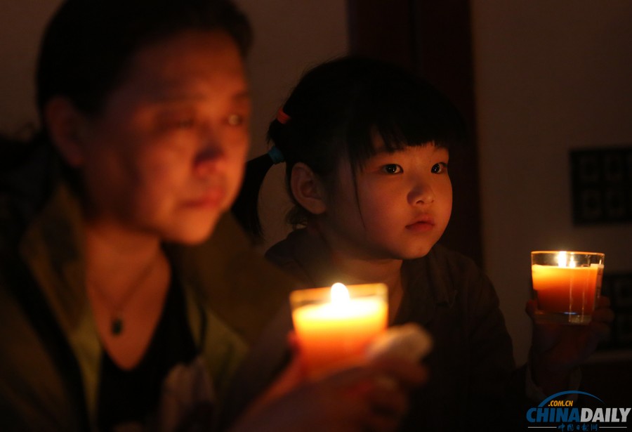 馬航MH370失聯(lián)客機整月 家屬為親人祈福守望
