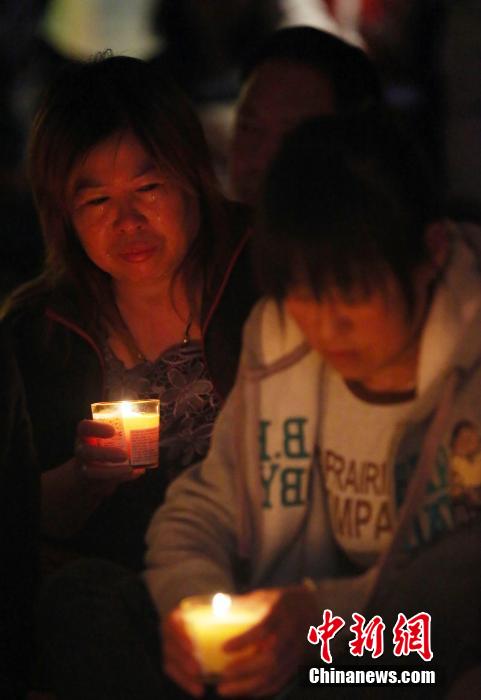 MH370航班失聯(lián)滿月 在京乘客家屬舉行祈?；顒?dòng)