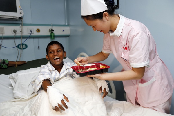 The 10-year-old boy from a care home in the Maldives after undergoing surgery on the Peace Ark to remove two extra fingers on each hand. Photos by Zhang Hao / for China Daily Hospital ship lends a helping hand