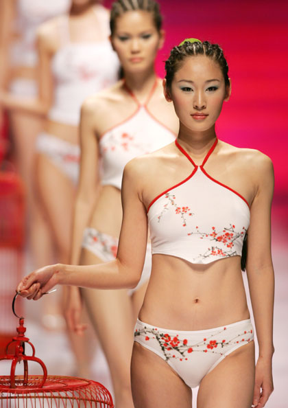 Chinese models present creations for HOSA China Lingerie Fashion Trend Collection 2006-2007 at the 14th China International Fashion Week in Beijing April 1, 2006. 