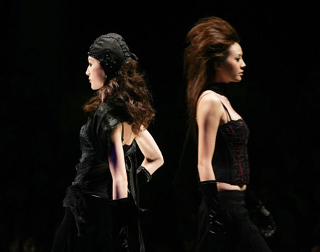Models present creations by Italy's Hybris fashion collection at the 14th China International Fashion Week in Beijing April 1, 2006. 