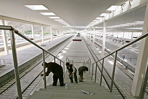 Workers makes final touches at the nearly finished Lhasa Railway Station in Lhasa, Tibet, June 24, 2006. The Qinghai-Tibet Railway, which will begin trial operations on July 1, 2006. Picture taken June 24, 2006. 