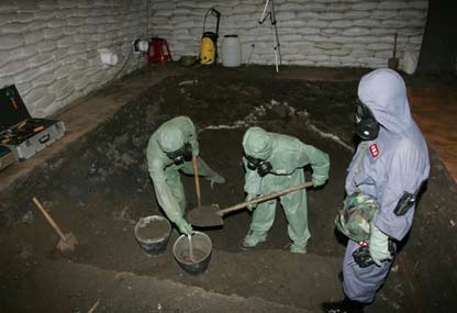 Chinese soldiers dig for chemical weapons abandoned by Japanese troops during World War Two, in Ning'an, China's Heilongjiang province, July 5, 2006. The two countries disagree on the scale of corroding weapons left behind by Japan's army after World War Two, with China saying there are 2 million shells to be dealt with, while Japan puts the figure in the hundreds of thousands. 