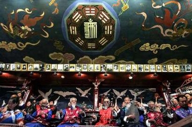 An ethnic Naxi Orchestra performs traditional music in Lijiang, southwestern China's Yunnan province, July 23, 2006. The orchestra performs music that has a history of more than one thousand years, and it claims to be the oldest orchestra in the world, with 440 years of history. The Naxi people are concentrated in northwestern Yunnan and are one of China's 56 ethnic groups. Picture taken July 23, 2006. 