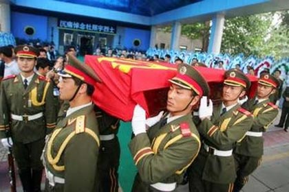 Chinese soldiers carry the coffin containing the body of Chinese UN observer Du Zhaoyu, who was killed last week during Israel's air raid on Lebanon, during a ceremony before his cremation in Beijing August 4, 2006.