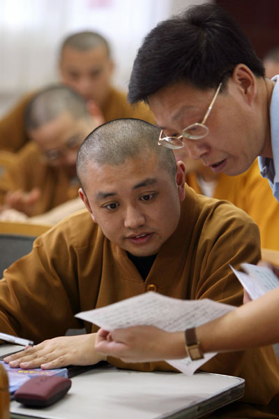 Chinese Buddhist monks attend secular classes as part of preparations for college entry exams in Yufo monastery in Shanghai August 9, 2006. Piety and a knowledge of Buddhist scriptures used to qualify one to be a Chinese monk. Now, add computer skills, foreign language ability and a degree in financial management. [Reuters]