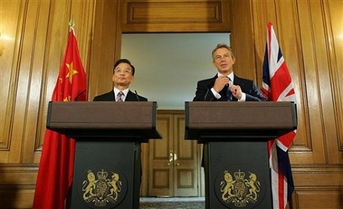 British Prime Minister Tony Blair, right, holds a joint press conference with his Chinese counterpart Wen Jiabao at No.10 Downing Street in central London, Wednesday Sept. 13, 2006. The two leaders met for potentially difficult talks that will focus on Iran and North Korea's nuclear programs while supporters and protesters lined the streets outside Blair's offices. 