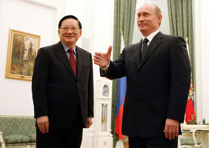 Russian President Vladimir Putin (R) welcomes China's top envoy on North Korea, Tang Jiaxuan, to talks in Moscow's Kremlin October 14, 2006. 