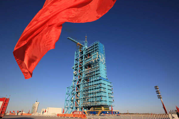 A red flag flies at the Jiuquan Satellite Launch Center in Northwest China's Gansu province, Sept 28, 2011. One small step for Tiangong-1