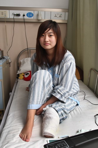 Zhu Yiyi, 19, of Jiangxi province, in the hospital after amputation of part of her left leg. Shanghai casts stone at glass houses over safety