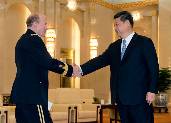 President Xi Jinping greets Chairman of the US Joint Chiefs of Staff General Martin Dempsey at the Great Hall of the People in Beijing on Tuesday. Andy Wong / Reuters China, US ready to enhance mutual trust
