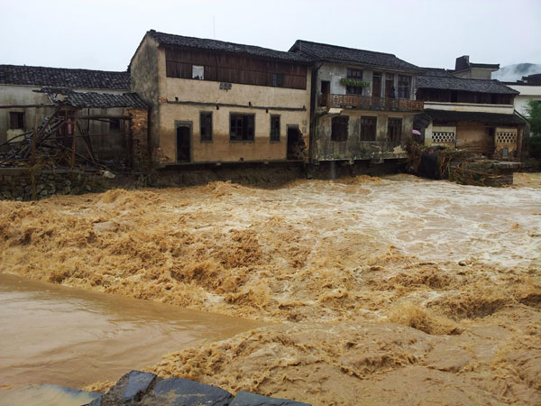 A flooded river in Chengkan village, Huangshan city, June 30, 2013. Rain-triggered floods kill 4 in E China