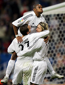 Real Madrid's Roberto Soldado (L), Robinho (C) and David Beckham celebrate Robinho's goal against Athletic Bilbao during their King's Cup soccer match at Real Madrid's Santiago Bernabeu stadium in Madrid, January 12, 2006. Real Madrid won by 4-0.