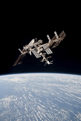 Photos first reveal docked space shuttle