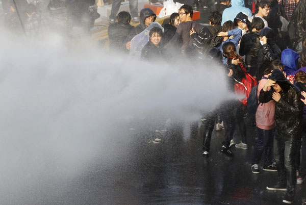 Riot police use water cannons to disperse protesters trying to march towards the National Assembly during a rally against the South Korea-US free trade agreement (FTA) talks in Seoul Nov 3, 2011. South Koreans protest free trade agreement with US