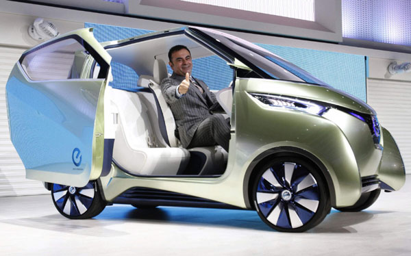 Carlos Ghosn, Chairman and CEO of Nissan and Renault, poses in Nissan's new concept car PIVO3 at the 42nd Tokyo Motor Show in Tokyo November 30, 2011. Tokyo Motor Show kicks off