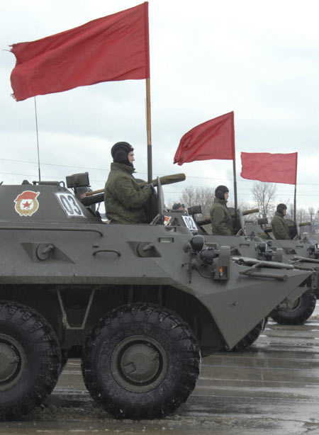 Servicemen operate Russian armoured personnel carriers during a rehearsal for the annual Victory Day parade at a base near the settlement of Alabino, some 30 km (19 miles) south-west of the capital Moscow March 19, 2012. Rehearsal for Russian Victory Day parade
