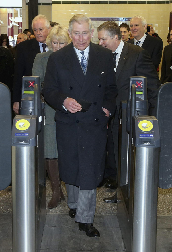Britain's Prince Charles and his wife Camilla, Duchess of Cornwall, travel on a Metropolitan line tube train from Farringdon station to King's Cross station, as they mark 150 years of the London Underground Jan 30, 2013. Prince Charles and Camilla surprise 'Tube' passengers