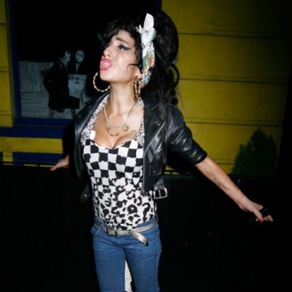 'Tattooed reptile' Amy Winehouse