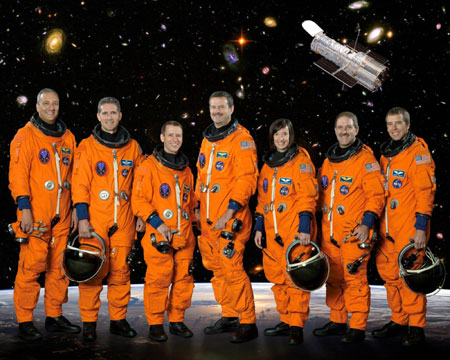Atlantis inspected for damage while chasing Hubble