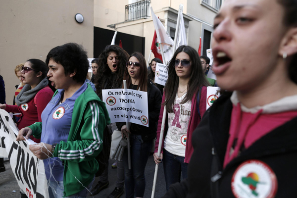 Cypriot students studying in Greek universities shout slogans during a rally against a levy on bank deposits in Cyprus, outside of the Cyprus embassy in Athens, March 19, 2013. Cypriot parliament rejects levy on bank deposits