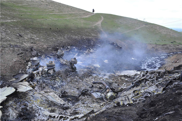 The wreckage of the Boeing KC-135 Stratotanker plane is seen at the site of the crash near the Kyrgyz village of Chaldovar, May 3, 2013. US military plane crashes in S. Kyrgyzstan