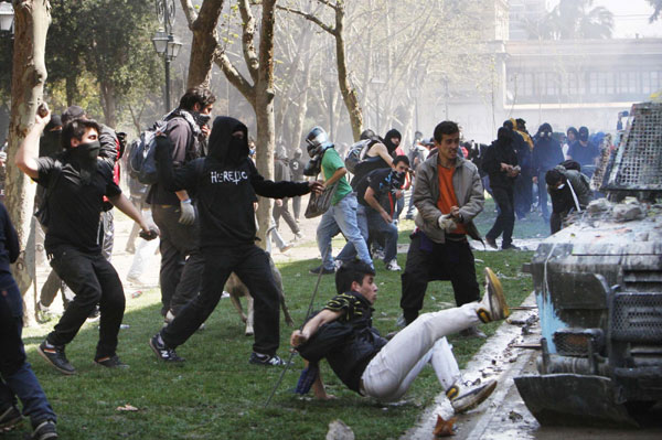 Demonstrators clash with riot police during a student rally against the government's public education system in Santiago city September 22, 2011. Chile: Students riot demanding education reform