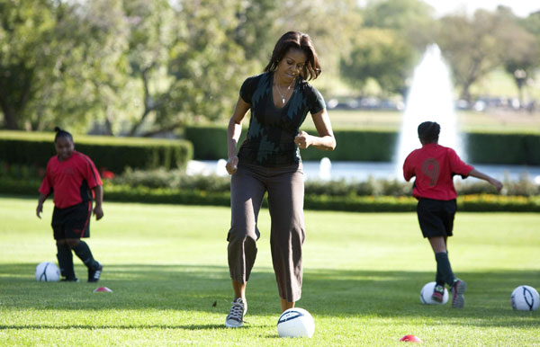 First lady Michelle Obama hosts a Let's Move! clinic with members of the US women's soccer team to teach kids soccer skills and highlight the importance of physical activity on the South Lawn of the White House in Washington October 6, 2011. US first lady shows off soccer skills at WH