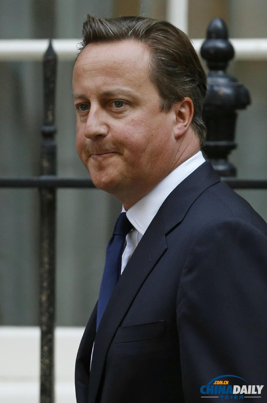 英國首相卡梅倫不敵議會反對 暫時擱置干預提議