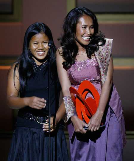 Cambodian activist Somaly Mam (R) accepts a