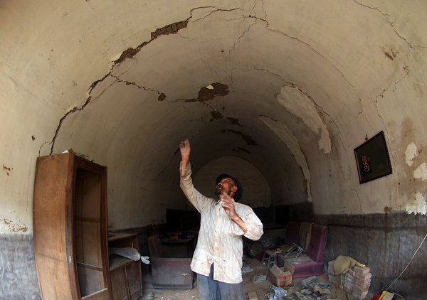 Cracks begin in the home of Gao Yanzhao, a 66-year-old man in Pangpangta village, Aug 15, 2011. Ground collapses undermine N China village