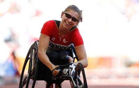 Canada&apos;s Michelle Stilwell reacts after women&apos;s 200M T52 final at the National Stadium，also known as the Bird&apos;s Nest，during the Beijing 2008 Paralympic Games in Beijing, Sept. 11, 2008. Stilwell won the gold medal with 36.18 seconds.(