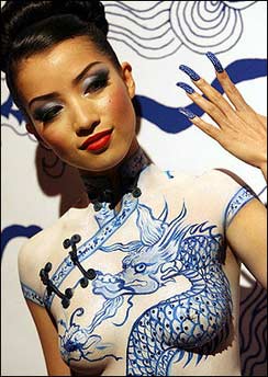 A model 
displays body 
paint at a live exhibition of the Qi Pao, the classic Chinese Dress, to officially launch Australian Fashion Week in Sydney. [AFP]