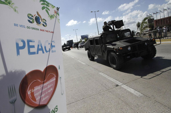 Cancun climate talks continue with protests