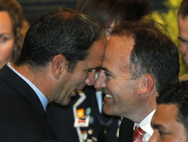 England's coach Martin Johnson (L) exchanges a hongi (traditional Maori greeting) with a local during the official welcome ceremony for the Rugby World Cup at Dunedin City Hall September 6, 2011. Hongi greeting ahead of Rugby World Cup