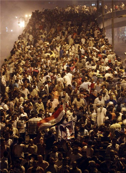 Supporters of deposed Egyptian President Mohamed Mursi shout slogans as they protest on the Sixth of October Bridge over the Ramsis square area in central Cairo Pro-Morsi protesters, police face off in Cairo