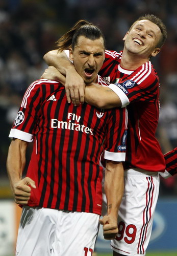 AC Milan's Zlatan Ibrahimovic (L) celebrates with his team mate Antonio Cassano after scoring against Viktoria Plzen in their Champions League Group H soccer match at Giuseppe Meazza stadium in Milan Sept 28, 2011. Barca make it look easy, Milan take their time