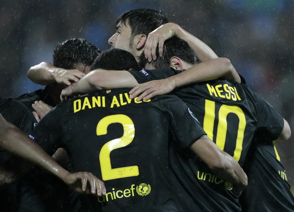 FC Barcelona's players celebrate after scoring a goal during their Champions League Group H soccer match against Bate Borisov at the Dinamo Stadium in Minsk Sept 28, 2011. Barca make it look easy, Milan take their time