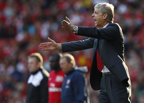 Arsenal's manager Arsene Wenger reacts during his team's English Premier League soccer match against Stoke City at the Emirates Stadium in north London, October 23, 2011. Don't panic, Wenger tells Arsenal fans