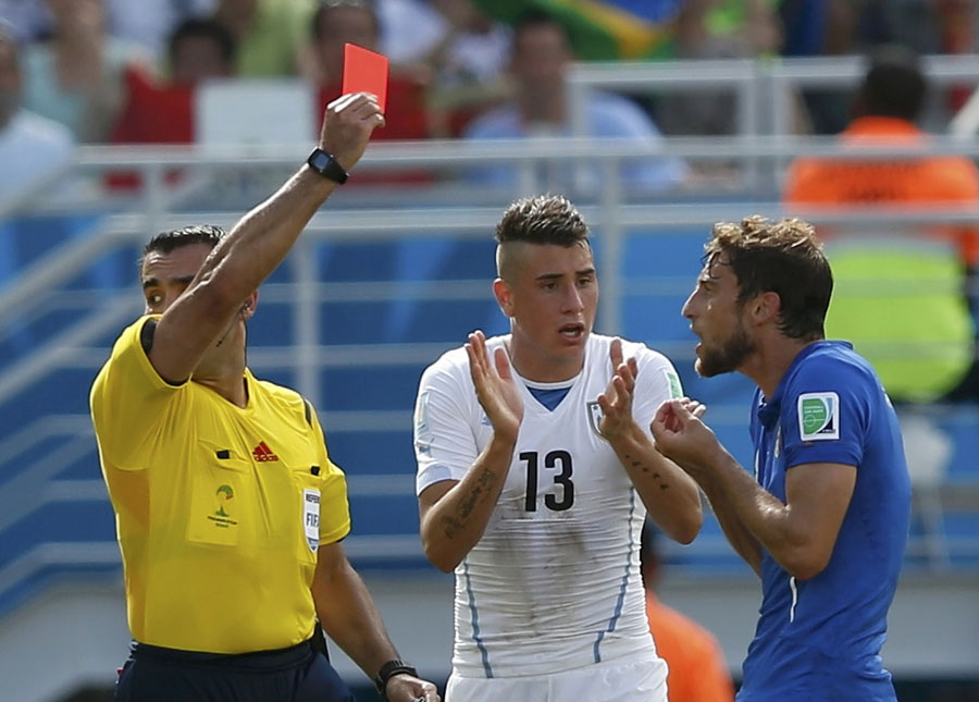 Suarez storm as Godin header sends Uruguay through