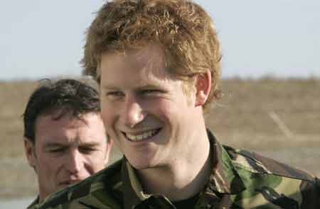 Britain's Prince Harry (R) smiles during his visit to the Royal Navy's fleet diving squadron at Horsea Island in Portsmouth, southern England, Oct. 31, 2007. It was Prince Harry's first official visit since becoming Commodore-in-Chief of small ships and diving.
