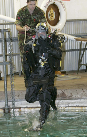 Britain&apos;s Prince Harry (front) dives into the water during his visit to the Royal Navy&apos;s fleet diving squadron at Horsea Island in Portsmouth, southern England, Oct. 31, 2007. It was Prince Harry&apos;s first official visit since becoming Commodore-in-Chief of small ships and diving.