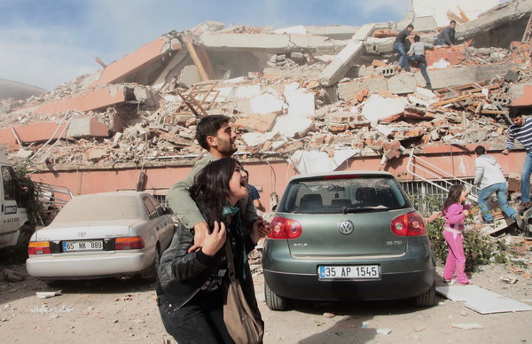 Survivors react after seeing the damage caused by an earthquake in the eastern Turkish city of Van on Sunday. The magnitude-7.2 earthquake may have killed up to 1,000 people as it triggered the collapse of dozens of buildings across the region, media reported the Kandilli Observatory as saying. Huge earthquake hits southeast Turkey