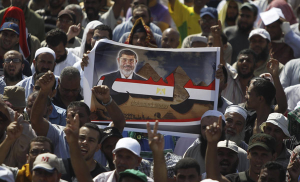 Morsi supporters defy police warnings to disperse
